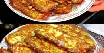 Plato de calabacines fritos con huevo sobre una mesa