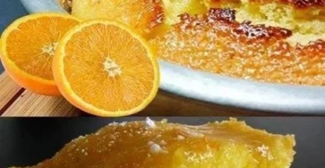 Pastel de naranja húmedo recién horneado, decorado con rodajas de naranja